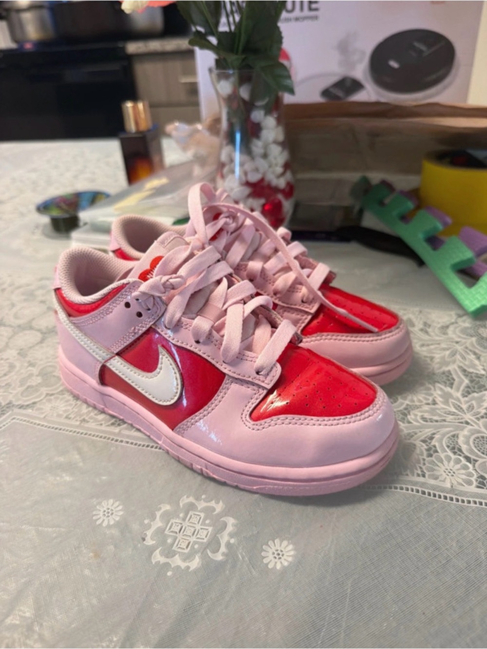 Nike Kids Pink and Red Low-Top Sneakers with White Swoosh